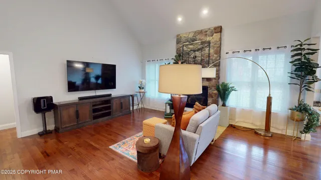 a living room with furniture and a flat screen tv