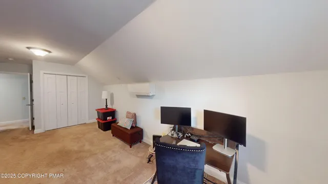 a bedroom with a workspace