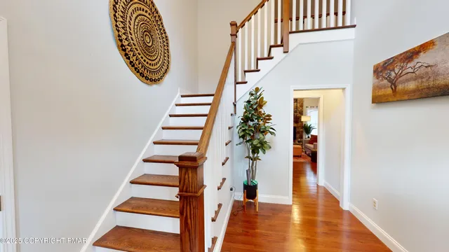 a view of entryway with wooden floor