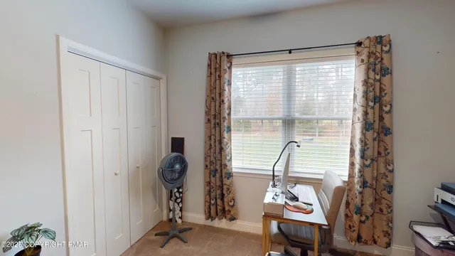 a room that has a window and a table in it