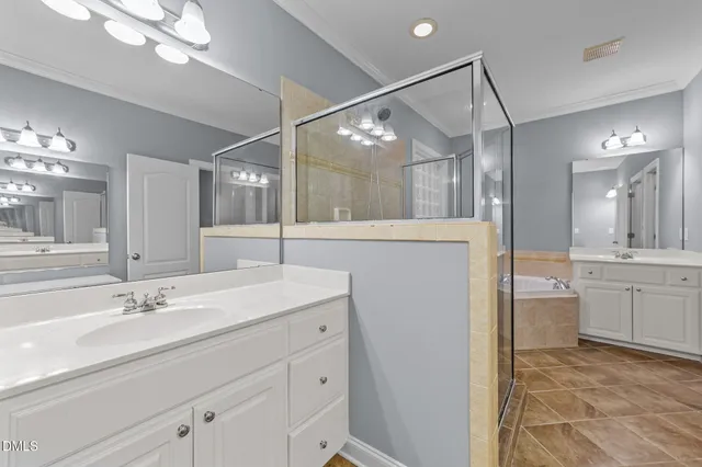 a bathroom with a sink vanity and a mirror