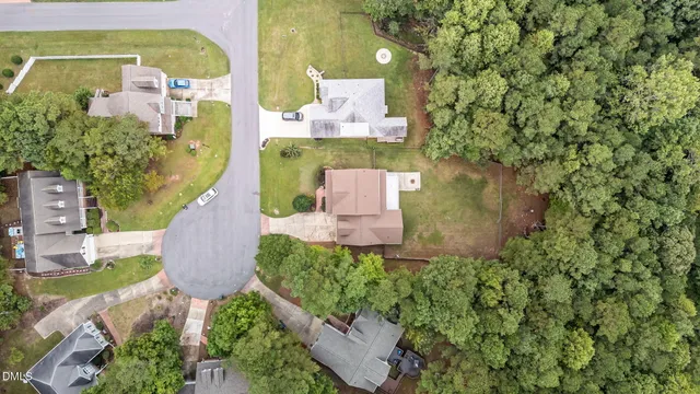 an aerial view of a house with a garden