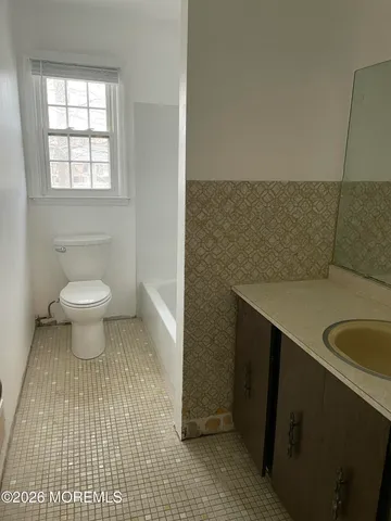 a bathroom with a sink and a toilet