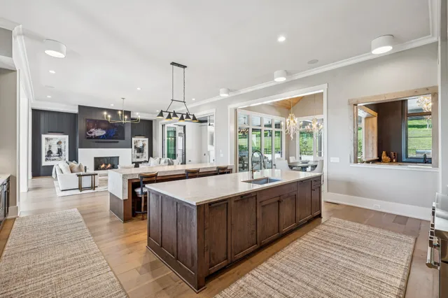 a kitchen with white cabinets and a sink