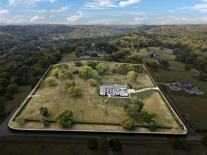 a view of a swimming pool with a yard