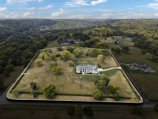 a view of a swimming pool with a yard