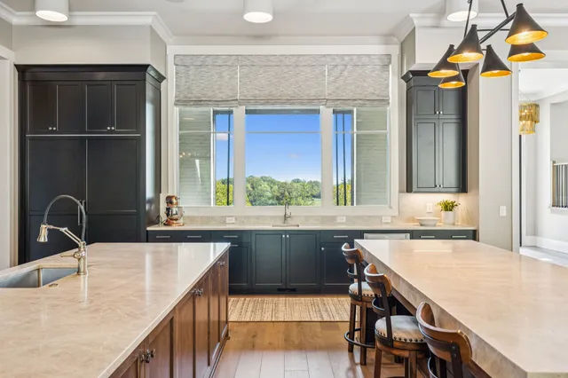 a utility room with sink dryer and washer