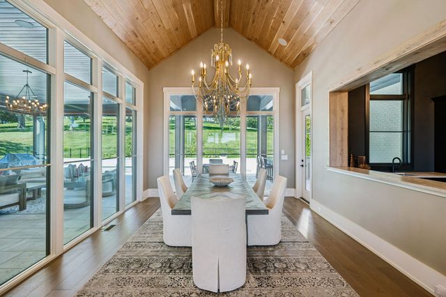 a white bath tub sitting in a en suite bathroom