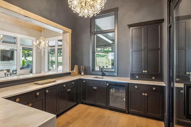 a bathroom with a sink vanity and mirror