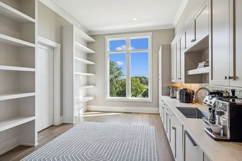 a bathroom with a sink vanity and a mirror