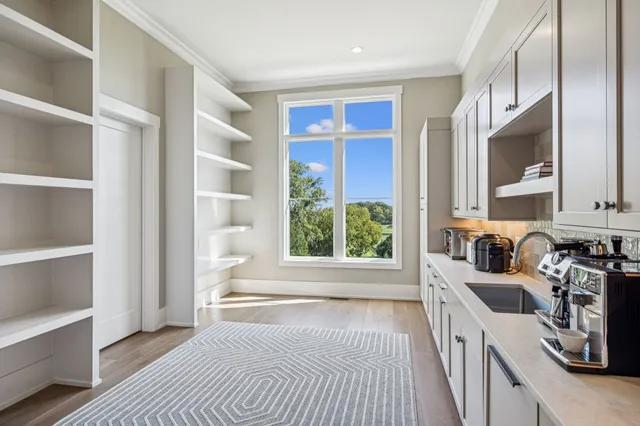 a bathroom with a sink vanity and a mirror