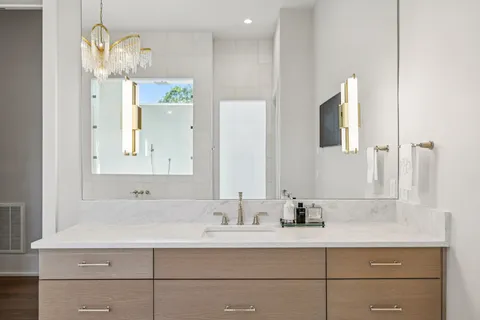 a living room with furniture and a ceiling fan