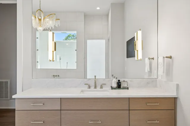a living room with furniture and a ceiling fan