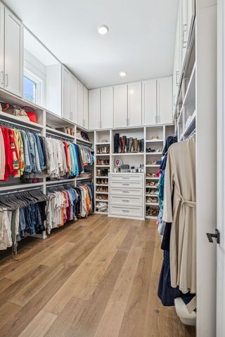 a room with pool table and windows