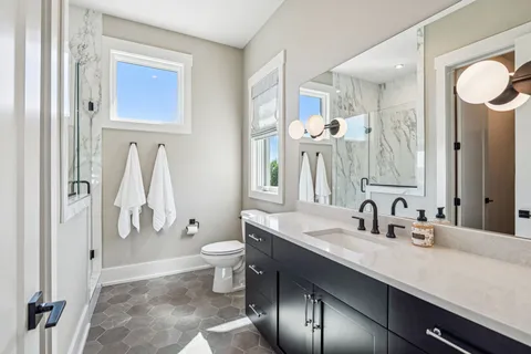 a living room with patio furniture and a flat screen tv