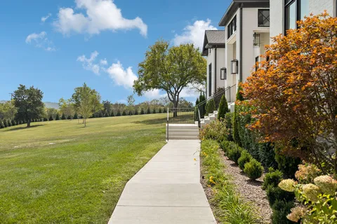 a view of entryway with wooden floor and windows