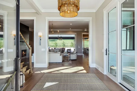 a view of entryway and hall with wooden floor