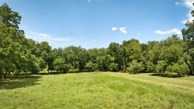 a view of outdoor space with deck and yard