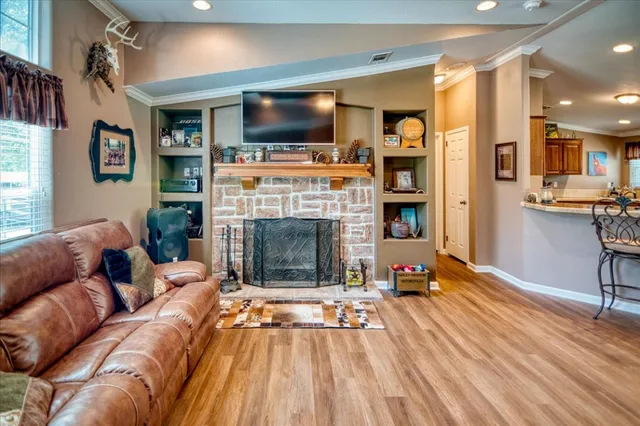 a large kitchen with a large counter top appliances and cabinets