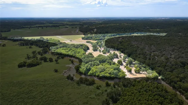 a view of a lake with a yard