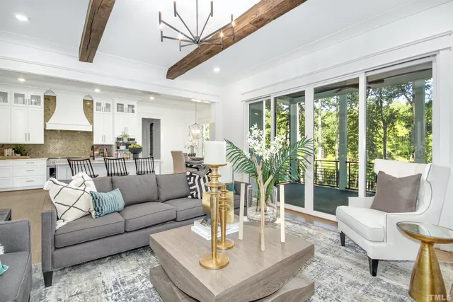 a bathroom with a toilet a sink a mirror and a window