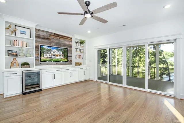 a bathroom with a sink a toilet a tub and shower