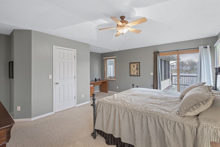834 Breckenboro Road Lake Summerset, IL 61019 - Photo 20 of 39 a bedroom with a bed and a chandelier