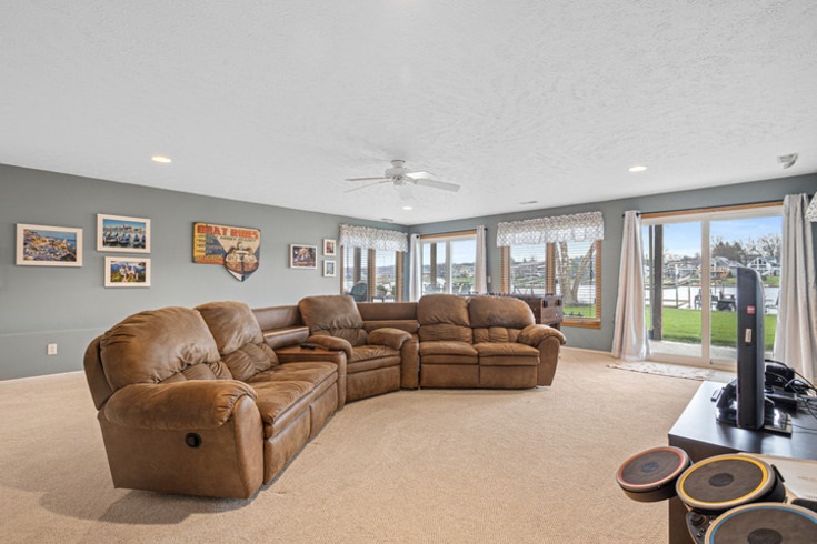 834 Breckenboro Road Lake Summerset, IL 61019 - Photo 24 of 39 a living room with furniture and a floor to ceiling window