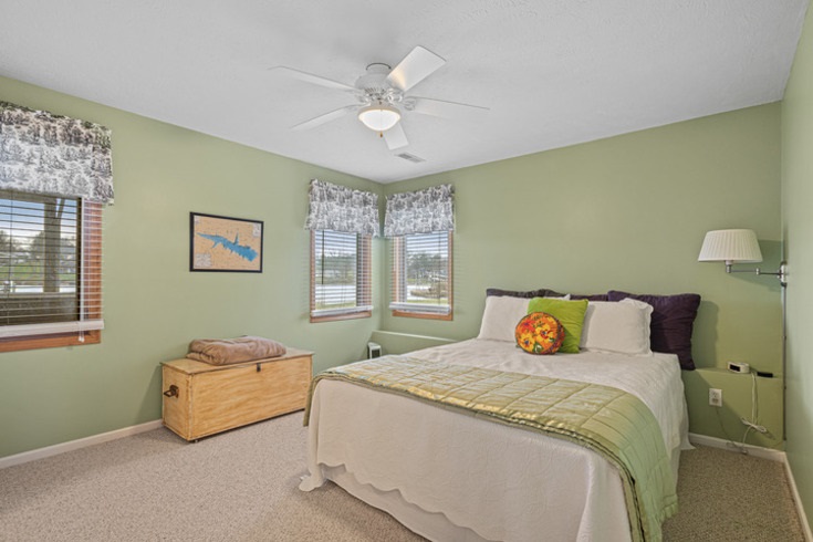 834 Breckenboro Road Lake Summerset, IL 61019 - Photo 26 of 39 a bedroom with a bed and a chandelier