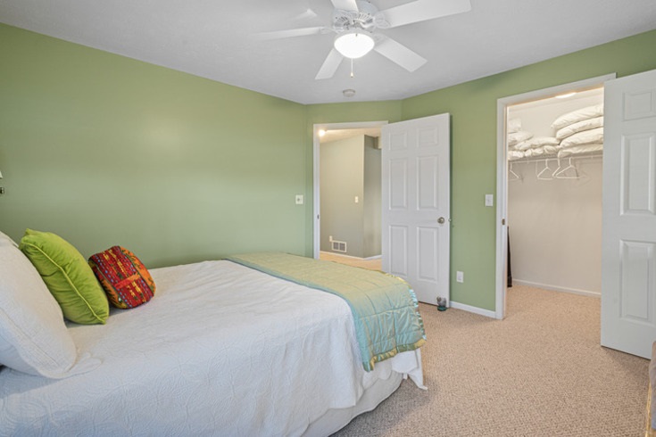 834 Breckenboro Road Lake Summerset, IL 61019 - Photo 27 of 39 a bedroom with a bed and a chandelier