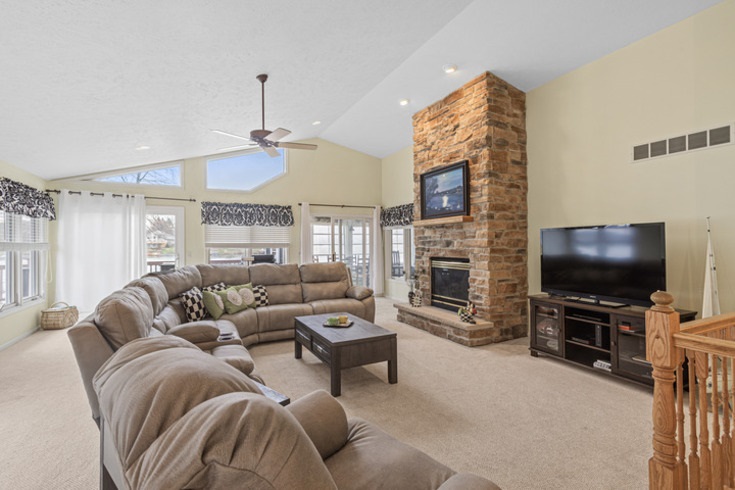 834 Breckenboro Road Lake Summerset, IL 61019 - Photo 6 of 39 a living room with furniture and a flat screen tv