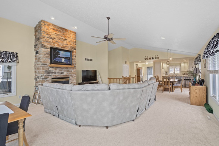 834 Breckenboro Road Lake Summerset, IL 61019 - Photo 7 of 39 a living room with furniture and a flat screen tv