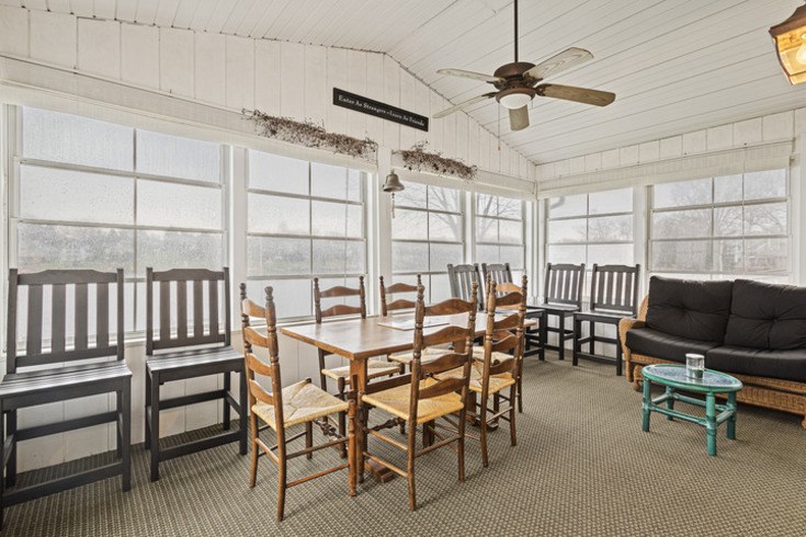 834 Breckenboro Road Lake Summerset, IL 61019 - Photo 10 of 39 a dining room with furniture and a floor to ceiling window