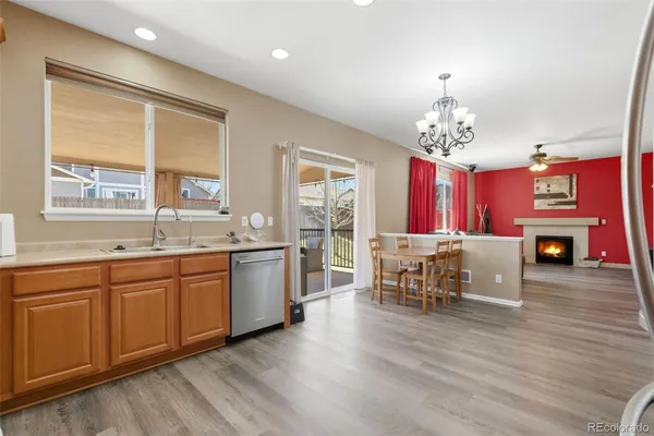 a large kitchen with a table and chairs