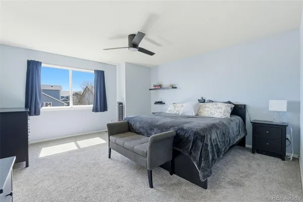 a bedroom with a bed and window