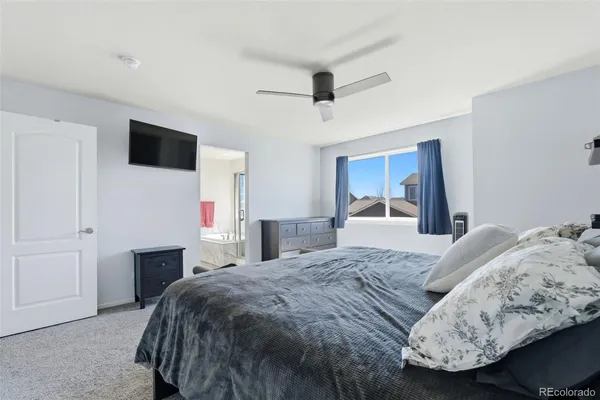a bed sitting in a bedroom and dresser