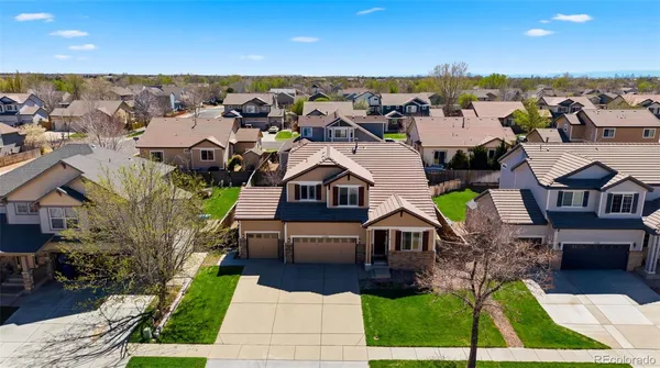an aerial view of a house with a garden