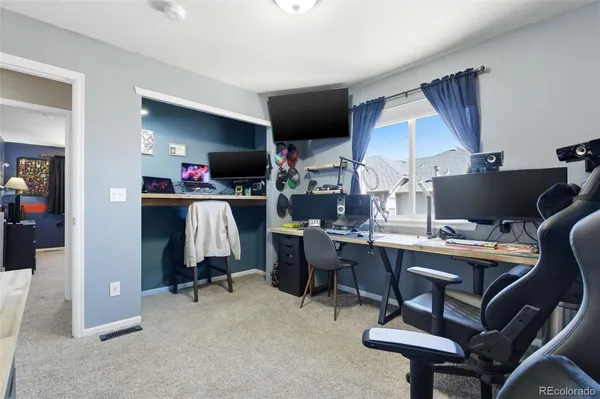a view of a workspace with furniture