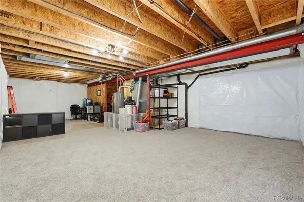 a view of empty room with wooden ceiling