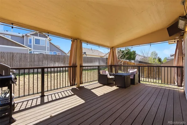 a view of balcony with wooden floor