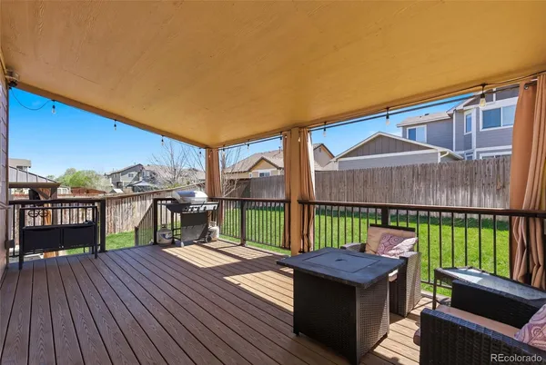 a view of a roof deck with a barbeque