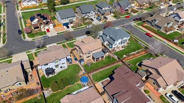an aerial view of a houses with a lot of trees