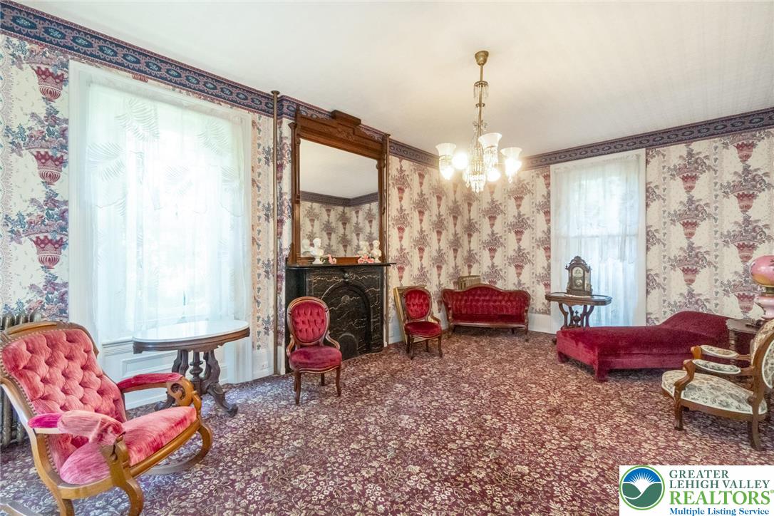 11 East Front Street Jim Thorpe, PA 18229 - Photo 17 of 63 a living room filled with furniture and a chandelier