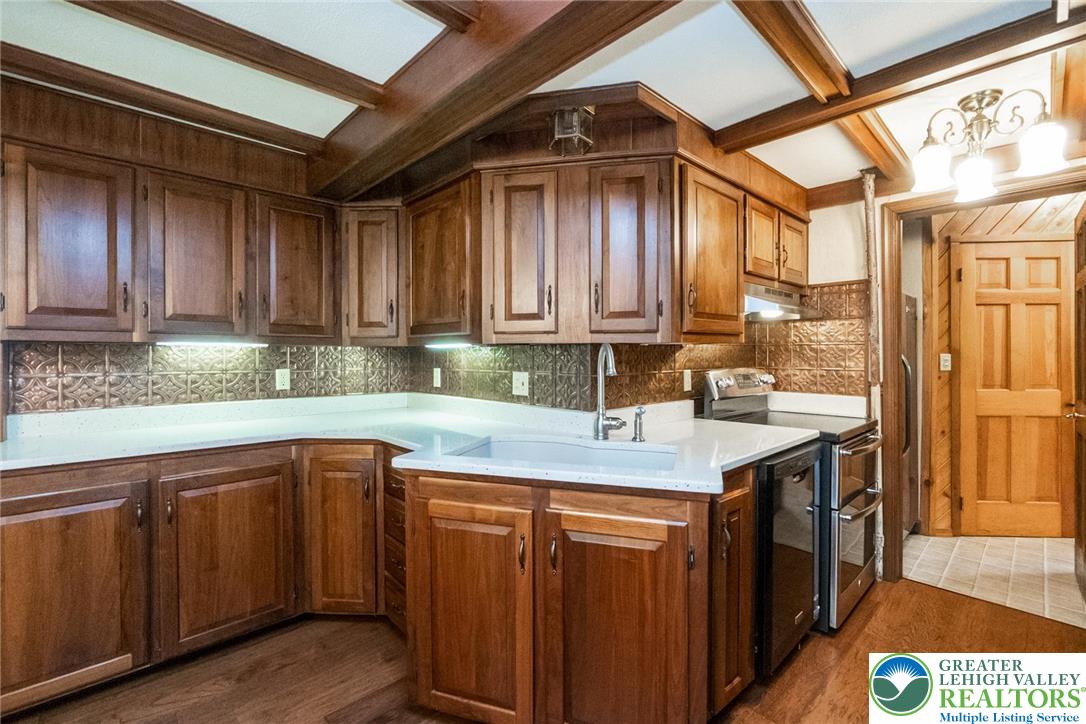 11 East Front Street Jim Thorpe, PA 18229 - Photo 23 of 63 a kitchen with a sink window and cabinets