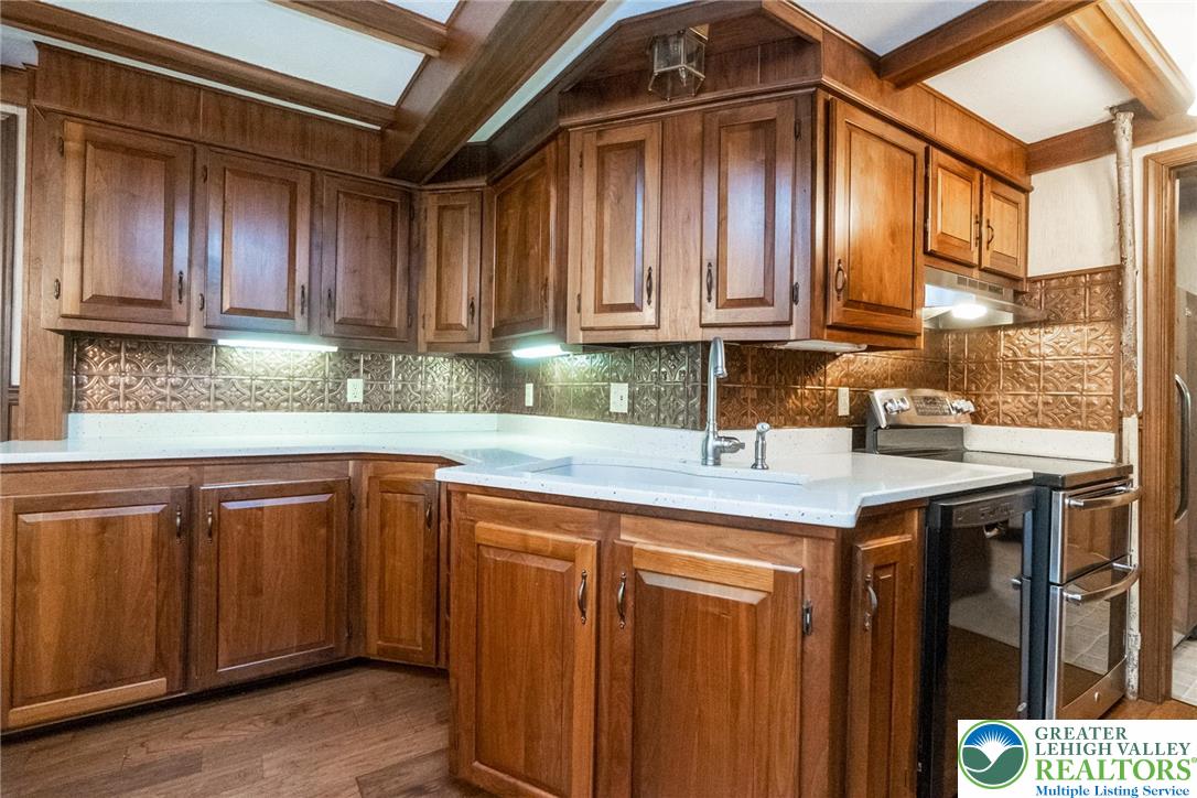 11 East Front Street Jim Thorpe, PA 18229 - Photo 24 of 63 a kitchen with stainless steel appliances granite countertop wooden cabinets a sink and dishwasher