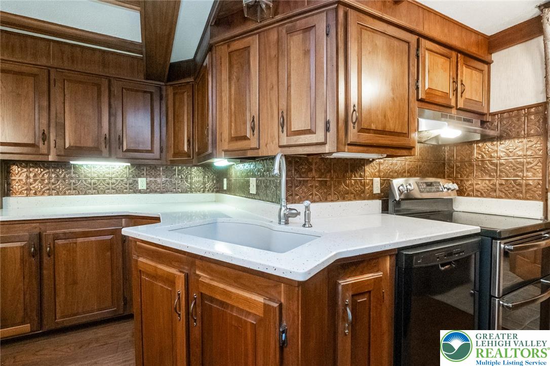 11 East Front Street Jim Thorpe, PA 18229 - Photo 26 of 63 a kitchen with stainless steel appliances granite countertop a sink a stove and cabinets