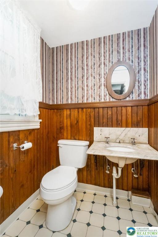 11 East Front Street Jim Thorpe, PA 18229 - Photo 35 of 63 a bathroom with a toilet a sink and a shower curtain
