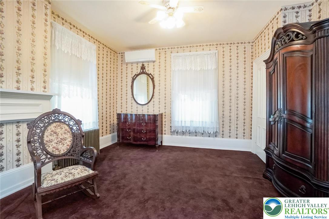 11 East Front Street Jim Thorpe, PA 18229 - Photo 48 of 63 a living room with furniture a window and a fireplace