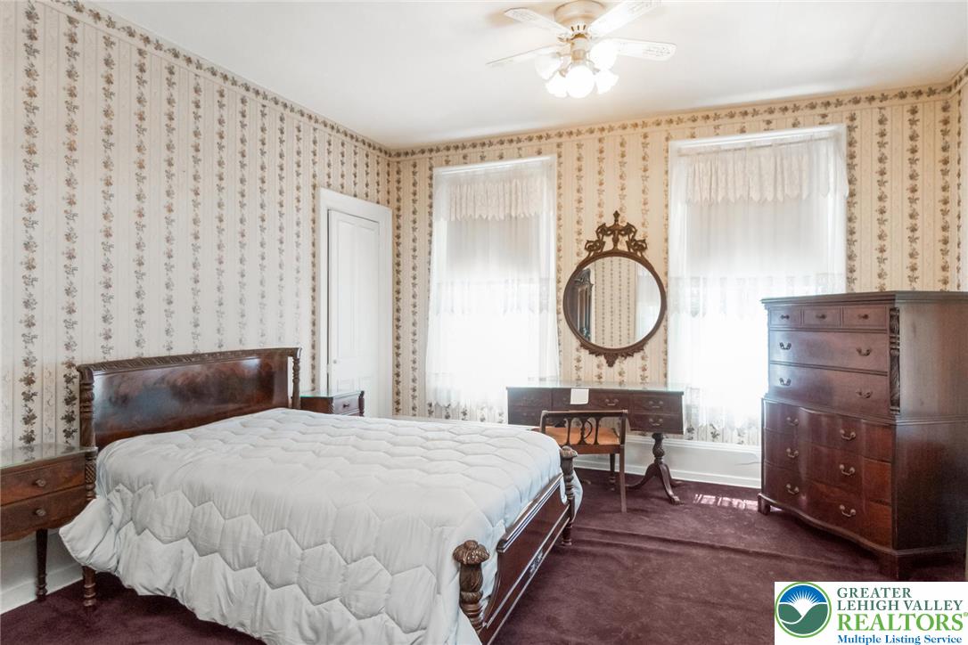 11 East Front Street Jim Thorpe, PA 18229 - Photo 50 of 63 a bedroom with a bed a dresser and chair