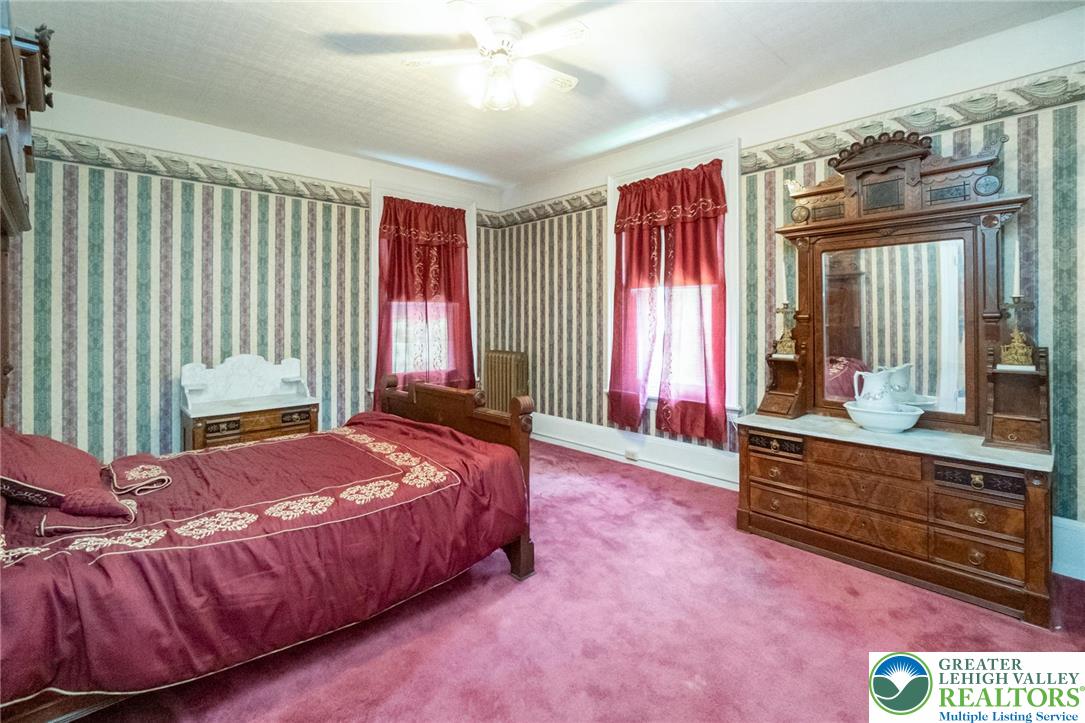 11 East Front Street Jim Thorpe, PA 18229 - Photo 56 of 63 a bedroom with a bed and large windows